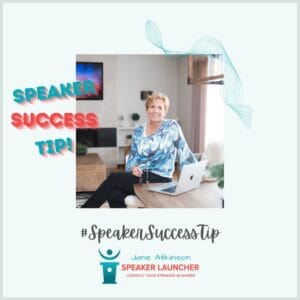 image of Jane Atkinson sitting at a table with a laptop holding a pair of glasses and text that says: Speaker Success Tip